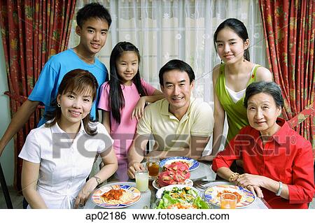Stock Photograph - Three generation family at home, portrait . Fotosearch