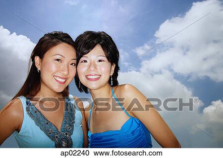 Two women smiling at camera View Large Photo Image Stock Image - Two women smiling at camera . Fotosearch