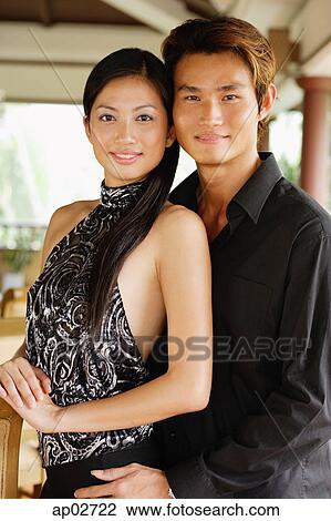Well dressed couple, looking at camera, portrait View Large Photo Image Stock Image - Well dressed couple, looking at camera, portrait . Fotosearch