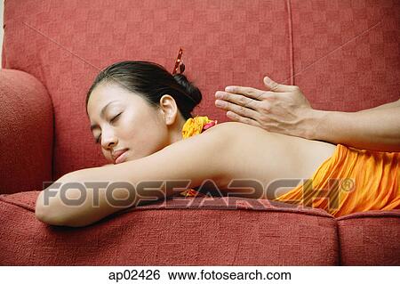 Woman getting a massage, eyes closed View Large Photo Image Stock Photograph - Woman getting a massage, eyes closed . Fotosearch