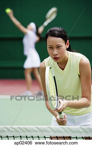 Stock Photograph - Woman holding tennis racket . Fotosearch