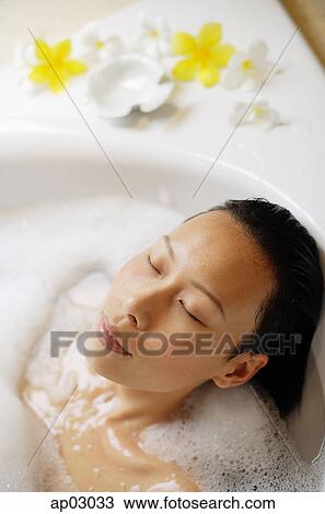 Woman in bathtub, eyes closed, head shot View Large Photo Image Stock Image - Woman in bathtub, eyes closed, head shot. Fotosearch