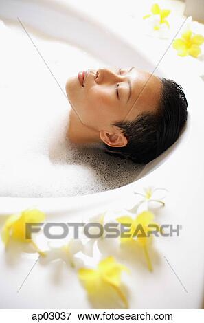 Woman in bathtub, taking bubble bath, eyes closed View Large Photo Image Stock Photo - Woman in bathtub, taking bubble bath, eyes closed. Fotosearch