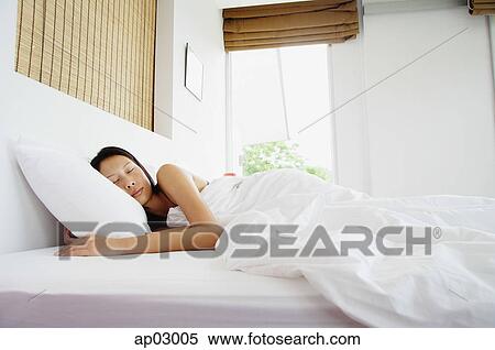 Woman in bedroom, sleeping View Large Photo Image Stock Photography - Woman in bedroom, sleeping. Fotosearch
