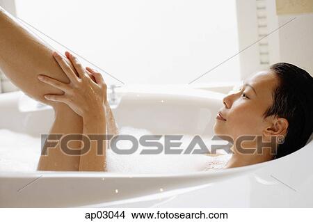 Woman washing leg View Large Photo Image Picture - Woman washing leg . Fotosearch