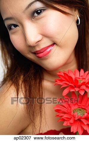 Woman with flowers, smiling, portrait View Large Photo Image Stock Photo - Woman with flowers, smiling, portrait . Fotosearch
