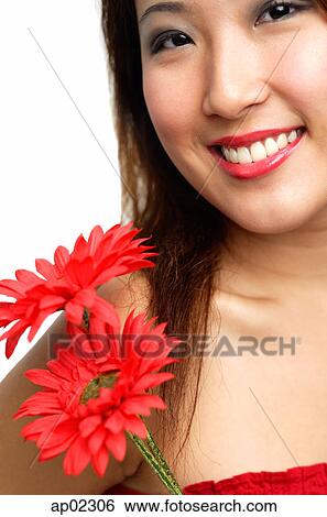 Woman with flowers, smiling View Large Photo Image Stock Photograph - Woman with flowers, smiling . Fotosearch