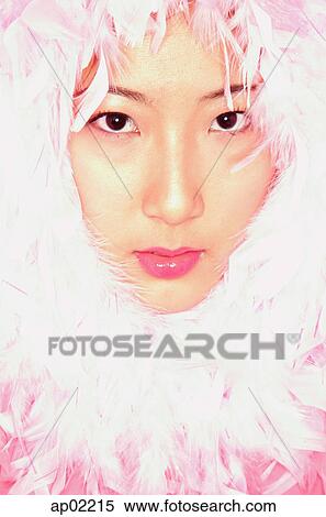 Womans face surrounded by feathers View Large Photo Image Stock Photography - Womans face surrounded by feathers . Fotosearch