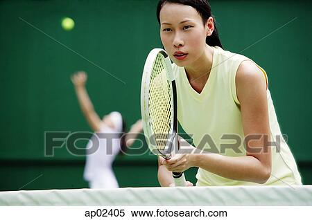 Stock Photography - Women playing tennis. Fotosearch