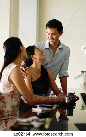 Young adults in restaurant View Large Photo Image Picture - Young adults in restaurant . Fotosearch