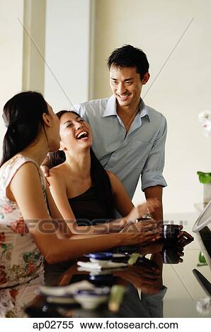 Young adults in restaurant, woman laughing View Large Photo Image Stock Photography - Young adults in restaurant, woman laughing . Fotosearch