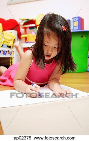 Young girl on floor drawing View Large Photo Image Stock Photo - Young girl on floor drawing . Fotosearch