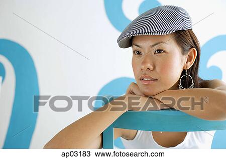 Young woman wearing beret, looking away View Large Photo Image Stock Image - Young woman wearing beret, looking away . Fotosearch