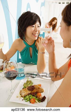 Young women in cafe, having lunch View Large Photo Image Stock Photograph - Young women in cafe, having lunch . Fotosearch
