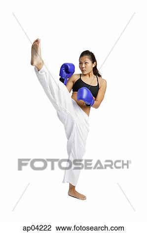 Female boxer with one leg raised View Large Photo Image Stock Photo - Female boxer with one leg raised. Fotosearch - Search Stock Photography, Print Pictures, Images, and Photo Clip Art