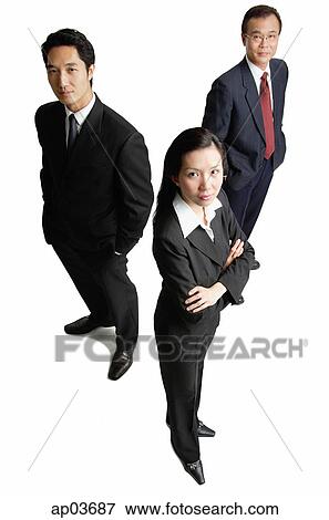 Business people standing, looking at camera View Large Photo Image Stock Photo - Business people standing, looking at camera . Fotosearch