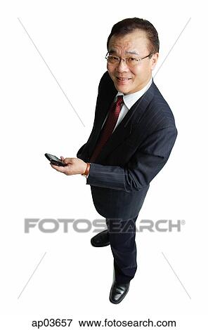 Businessman holding mobile phone View Large Photo Image Stock Photo - Businessman holding mobile phone . Fotosearch