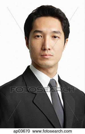 Businessman looking at camera, head shot View Large Photo Image Stock Image - Businessman looking at camera, head shot. Fotosearch