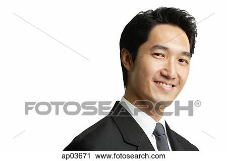 Businessman smiling at camera, head shot View Large Photo Image Stock Image - Businessman smiling at camera, head shot . Fotosearch