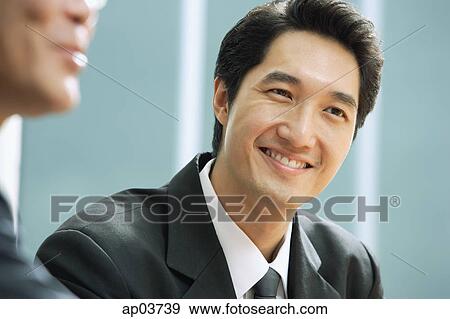 Stock Photo - Businessman smiling. Fotosearch