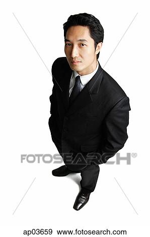 Businessman standing with hands in pockets View Large Photo Image Stock Photo - Businessman standing with hands in pockets. Fotosearch