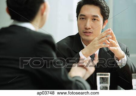 Businessman talking to businesswoman View Large Photo Image Stock Photo - Businessman talking to businesswoman. Fotosearch