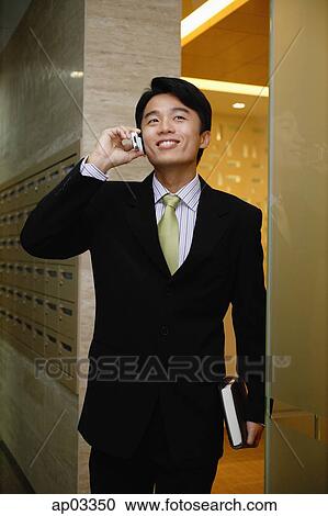 Businessman using mobile phone View Large Photo Image Stock Image - Businessman using mobile phone. Fotosearch