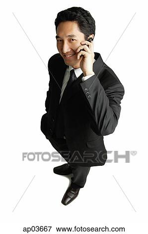 Businessman using mobile phone View Large Photo Image Stock Photo - Businessman using mobile phone . Fotosearch