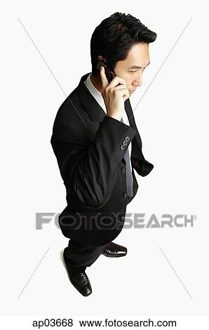 Stock Photo - Businessman using mobile phone . Fotosearch