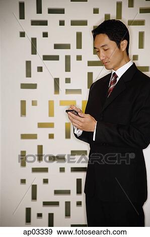 Businessman using PDA View Large Photo Image Stock Photo - Businessman using PDA. Fotosearch