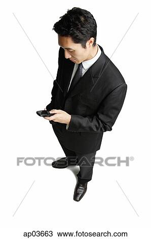 Businessman with mobile phone View Large Photo Image Stock Image - Businessman with mobile phone. Fotosearch