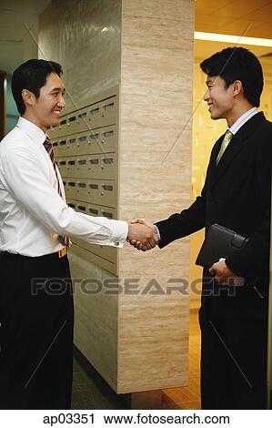 Businessmen shaking hands View Large Photo Image Stock Image - Businessmen shaking hands. Fotosearch