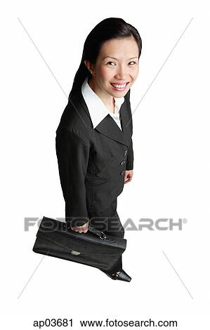 Businesswoman holding briefcase, smiling at camera View Large Photo Image Stock Image - Businesswoman holding briefcase, smiling at camera . Fotosearch