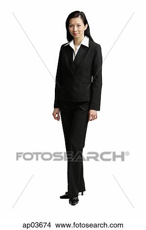 Businesswoman standing, looking at camera View Large Photo Image Picture - Businesswoman standing, looking at camera . Fotosearch