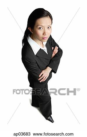 Businesswoman standing with arms crossed View Large Photo Image Stock Image - Businesswoman standing with arms crossed . Fotosearch