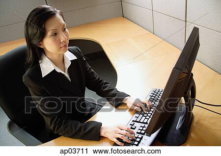 Businesswoman using computer in office View Large Photo Image Stock Image - Businesswoman using computer in office . Fotosearch