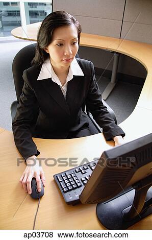 Businesswoman using computer View Large Photo Image Stock Photo - Businesswoman using computer . Fotosearch