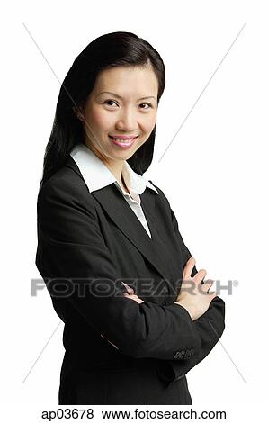 Businesswoman with arms crossed, smiling View Large Photo Image Stock Photo - Businesswoman with arms crossed, smiling. Fotosearch