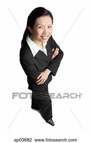 Businesswoman with arms crossed, smiling at camera View Large Photo Image Stock Image - Businesswoman with arms crossed, smiling at camera . Fotosearch
