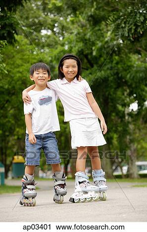 Children on inline skates, arms around each other View Large Photo Image Stock Image - Children on inline skates, arms around each other . Fotosearch