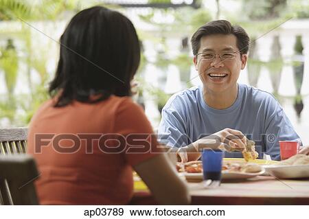 Couple having lunch View Large Photo Image Stock Photo - Couple having lunch . Fotosearch