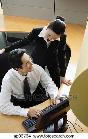 Executives in cubicle talking View Large Photo Image Picture - Executives in cubicle talking. Fotosearch