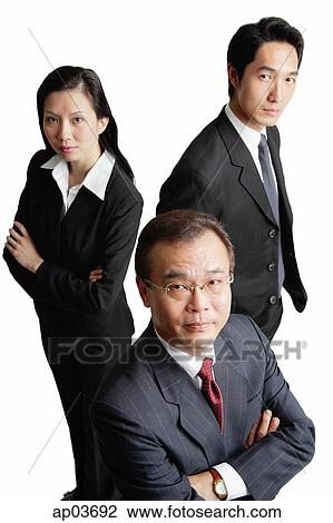 Executives looking at camera, serious expressions View Large Photo Image Stock Image - Executives looking at camera, serious expressions . Fotosearch
