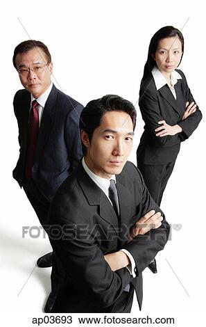 Executives looking at camera, serious expressions View Large Photo Image Stock Image - Executives looking at camera, serious expressions . Fotosearch
