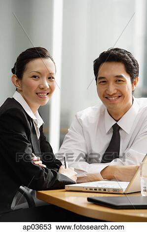 Executives smiling at camera View Large Photo Image Stock Image - Executives smiling at camera . Fotosearch