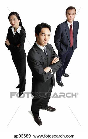 Executives standing, looking at camera View Large Photo Image Stock Photo - Executives standing, looking at camera . Fotosearch