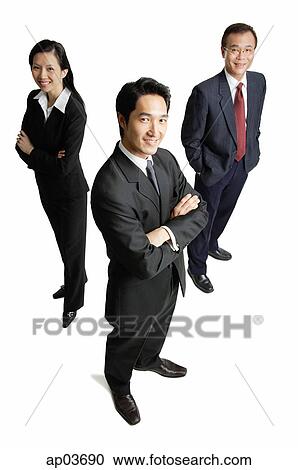 Executives standing, smiling at camera View Large Photo Image Stock Image - Executives standing, smiling at camera . Fotosearch