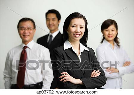 Executives standing together, arms crossed View Large Photo Image Stock Image - Executives standing together, arms crossed. Fotosearch