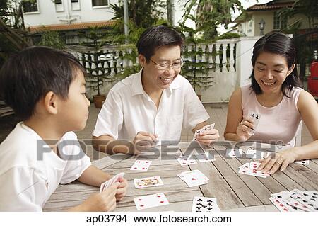 Family playing cards View Large Photo Image Picture - Family playing cards . Fotosearch