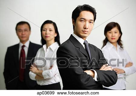 Four business people looking at camera View Large Photo Image Stock Photo - Four business people looking at camera . Fotosearch